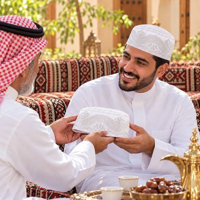 Embroidered Kufi – Wave — in a majlis setting