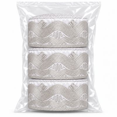 Embroidered Kufi – Wave — in its packaging bag
